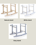 Three different color options for a stand: natural, white, and grey.